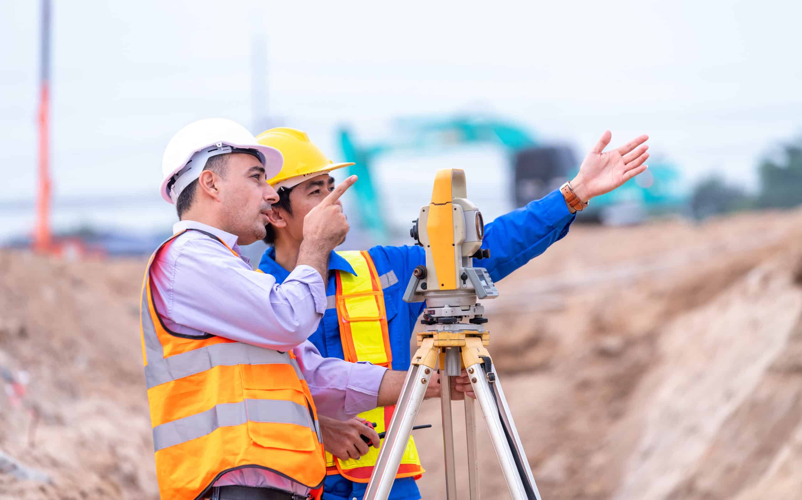 surveyor engineers wearing safety uniform helmet